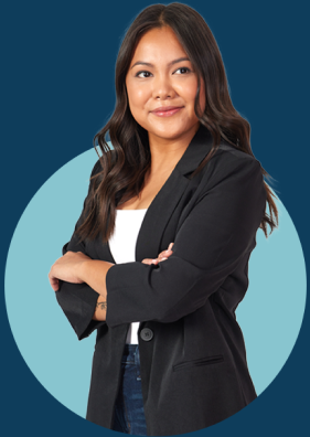 woman in business attire with arms crossed